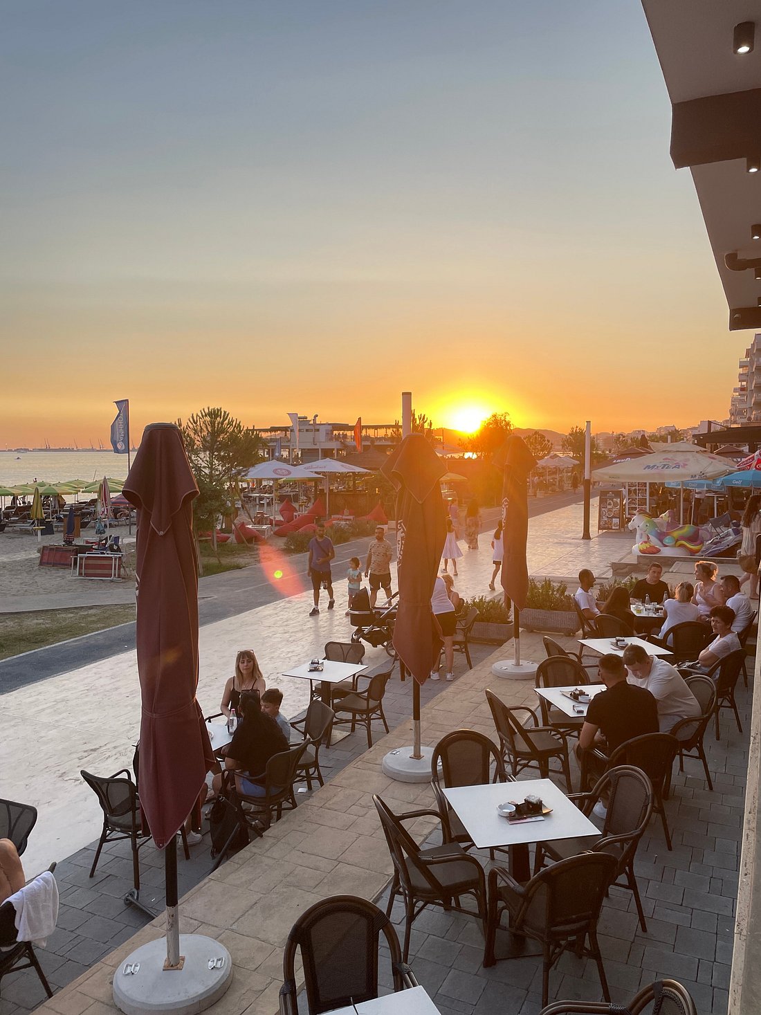 Restaurant exterior, beachfront, evening light